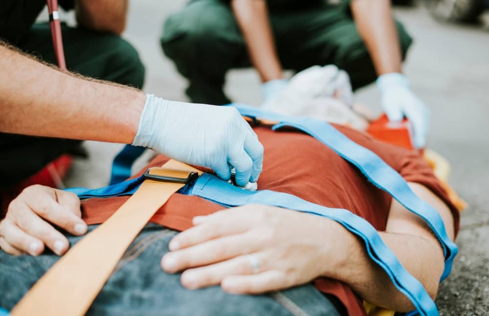 Paramedics rescuing car crash patient.